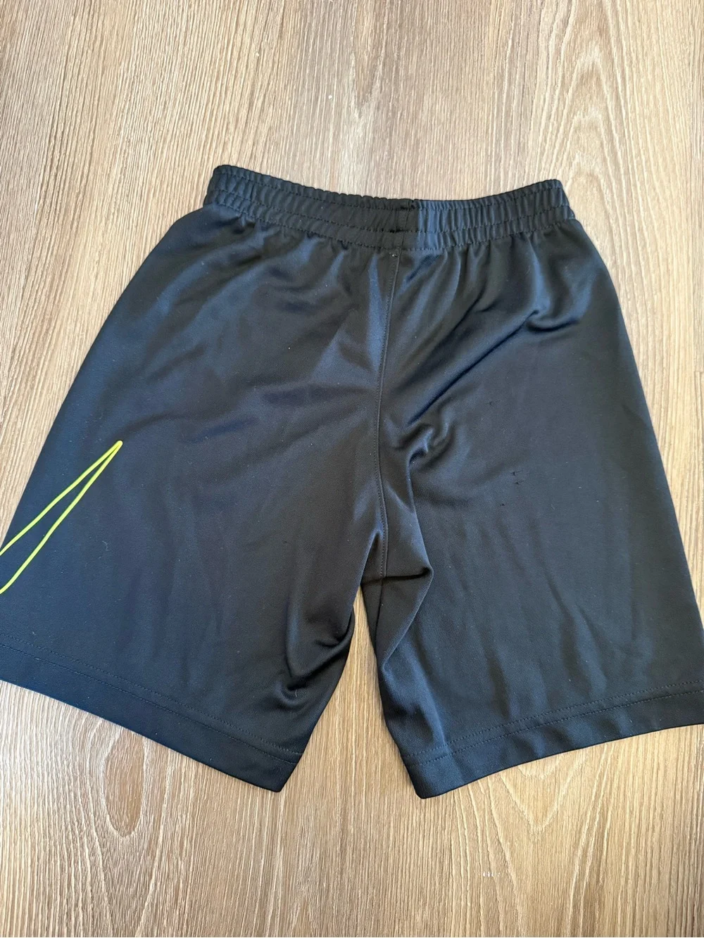 Boys Nike Black Athletic Shorts with Yellow Swoosh - size 7 (L)